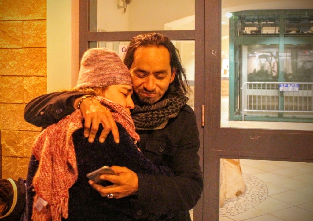 Equipto hugs his sister Sandra Vasquez outside mission police station. Photo by Sana Saleem